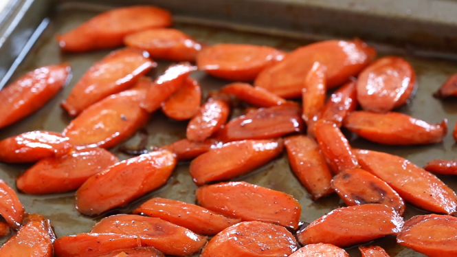 cooked honey butter carrots on baking sheet
